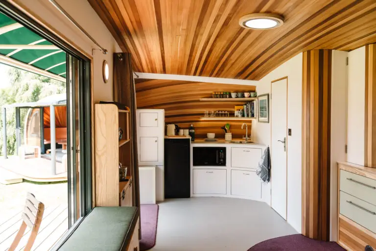 Compact kitchenette inside bespoke pod by Timeless Composites